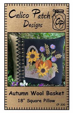 an autumn wool basket pillow with sunflowers and daisies on it, in front of