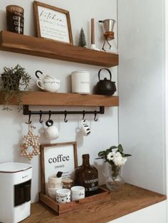 some shelves with coffee mugs and other items on them