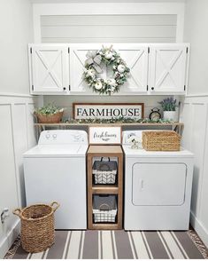 a white washer and dryer sitting next to each other in a laundry room