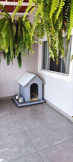 a small dog house with a cat in it