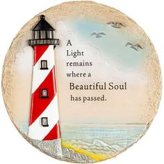 a red and white lighthouse with a poem on the bottom that says, a light remains where a beautiful soul has passed