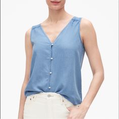 New With Tag. Gap Button Front V-Neck Denim Tank Top. Size Small. -Button Front -V-Neck & V-Back -Lightweight Fabric& Care -100% Lyocell; Machine Wash Cold Approx. Measurements: Pit-To-Pit: 17.5" Length: 21" Rn54023 Make Me An Offer Or Bundle For Further Discounts. Happy Poshing #A10 Sleeveless Chambray, Denim Tank Top, Denim Tank, V Neck Tank Top, Fit N Flare Dress, Fit & Flare, Jean Coat, Flare Dress, Trending Shoes