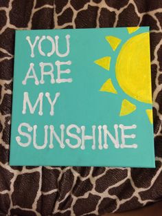 you are my sunshine painted on a piece of wood with giraffe print fabric