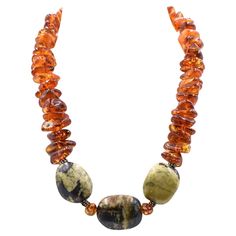 Vintage large freeform baltic honey amber bead necklace featuring sterling silver beaded rondelles as well as an adjustable sterling silver lobster clasp. The amber is accented by 3 large black and green stones. The necklace can be adjusted from 17" to 18.40". The amber beads are approximately .75" wide. Stone Bead Necklace, Amber Bead Necklace, Beaded Jewelry Bracelets, Beaded Necklace Diy, Green Stones, Turquoise Bead Necklaces, Stone Beaded Necklace, Handcrafted Artisan Jewelry, Amber Beads