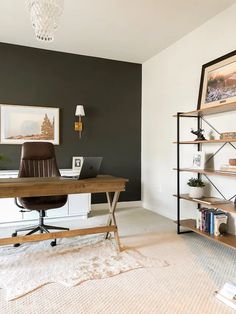 a home office with a desk, shelves and bookshelf in front of the wall