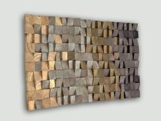 a wall sculpture made out of wood blocks