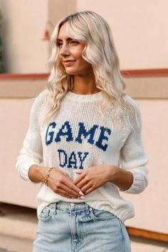 Product Details This incredibly soft and cozy crew features the phrase "Game Day" knit directly into the center front. With a relaxed fit and raglan sleeves this sweater has a sporty look. Additional details include ribbing on the neckline, cuffs and hem. Details & Fit Crew neck Light-weight cozy sweater knit Wide rib at neckline, cuff, and hem Raglan sleeve Length from shoulder to hem: 24" (size small) Materials & Care 76% acrylic, 12% mohair, 12% wool Machine Washable Collegiate Sweater For Game Day In Fall, Collegiate Fall Sweater For Game Day, Collegiate Style Sweater For Game Day In Fall, Fall Collegiate Sweater For Loungewear, Collegiate Sweater For Loungewear In Fall, Collegiate Style Sweater For Fall Loungewear, White Winter Leisure Sweater, Sporty Raglan Sleeve Sweater With Ribbed Cuffs, Long Sleeve Sweater With Ribbed Cuffs For Game Day