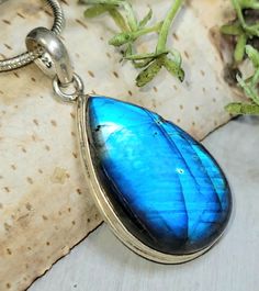 "Natural Handmade Premium Grade Pear Blue Flash Labradorite.925 Sterling Silver Pendant 1 3/4\" x 7/8\" 10 Grams HA35. This is a handpicked natural stone, the exact one shown in picture.  The sterling silver is .925 and stamped.  Each piece is handmade by artisans in my shop.  The quality of the stones and the silver workmanship is impressive.  Please look at other items in my store.  I sell ready made jewelry with hand crafted silver work, pendants with a sterling silver bails and beautiful unique stones for jewelry wire wrapping and weaving. You will pay exact amount on shipping plus $1 for supplies and labor. All items are shipped within a couple of days after payment and are shipped USPS first class or international first class.  Items are available for combined shipping, if invoice do Blue Labradorite Jewelry With Large Stone, Handmade Blue Labradorite Gemstones, Blue Teardrop Gemstones As A Gift, Labradorite Jewelry, Made Jewelry, Silver Work, Jasper Pendant, Blue Labradorite, Statement Pendant