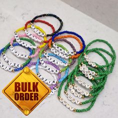 "This listing is for BULK ORDERS ONLY You can make different designs for each bracelet. In bulk orders and special days, production and cargo delivery may take a long time. Therefore, it is better to order 15 days in advance.  Ready to ship in 10 pcs - 200 pcs 3-5 business days 200 pcs - 500 pcs 5-7 business days 500 pcs - 1000 pcs 1 week Bulk orders are for 10+ more of these bracelets, customized by you. These are great for an event, fundraiser, sports team, team building gifts, wedding parties Personalized Green Craft Supplies For Gift, Assorted Color Bracelets With Letter Beads As A Gift, Assorted Letter Beads Bracelets For Gift, Assorted Letter Beads Bracelets For Gifts, Assorted Letter Beads Bracelets As Gift, Customizable Green Beaded Bracelets, Letter Beads Friendship Bracelets For Crafting, Customized Multicolor Beaded Bracelets For Gifts, Customized Spiritual Beaded Bracelets