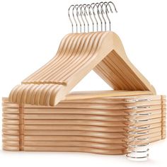 wooden clothes hangers stacked on top of each other