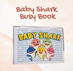 an advertisement for baby shark busy book, with three sharks on it's back