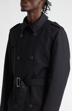 A timeless design is updated for today's intemperate weather, resulting in this trench coat tailored from tear-resistant fabric and lined in water-resistant quilted nylon filled with warming, lightweight insulation. Double-breasted button closure Notched collar with hook-and-eye throat latch Side welt pockets Removable belt Epaulets Gun flap Back vent Water resistant Nylon lining, with 100% polyester fill 55% polyester, 45% virgin wool Dry clean Made in Italy Designer Clothing Classic Double-breasted Gabardine Outerwear, Classic Gabardine Outerwear With Double-breasted Fastening, Modern Black Double-breasted Outerwear, Designer Black Outerwear With Belted Cuffs, Black Designer Outerwear With Belted Cuffs, Business Outerwear With Double-breasted Button In Gabardine, Business Double-breasted Gabardine Outerwear, Business Gabardine Outerwear With Double-breasted Button, Classic Outerwear With Belted Cuffs