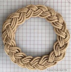 a rope ring is shown on top of a cutting board, ready to be made into a wreath