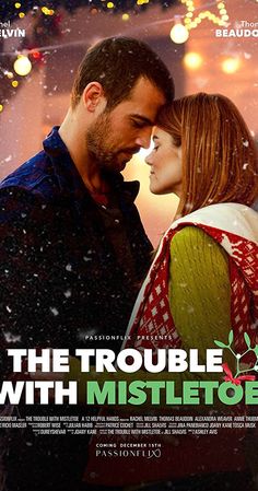 the trouble with mistletoe poster showing a man and woman kissing in front of christmas lights