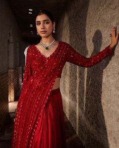 Make a statement in this red lehenga set that exudes elegance and sophistication. The one-side front palla attached to the blouse showcases full floral and geometric embroidery, creating a striking visual impact. The skirt, crafted from crinkle fabric, adds a touch of grace to the ensemble. Designed for comfort, the outfit is padded and features a concealed zip for a seamless fit. Step into timeless beauty with this meticulously crafted red lehenga set, perfect for special occasions where you wa Red Traditional Drape Party Dress, Red Party Dress With Traditional Drape, Designer Red Pre-draped Floor-length Saree, Red Georgette Lehenga For Evening, Anarkali Blouse Piece With Dupatta For Evening, Elegant Red Anarkali Set With Unstitched Blouse, Red Evening Sets With Unstitched Blouse, Semi-stitched Anarkali Set For Evening With Traditional Drape, Red Floor-length Sharara With Unstitched Blouse