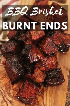 bbq brisket burnt ends on a cutting board with text overlay that reads bbq bushet burnt ends