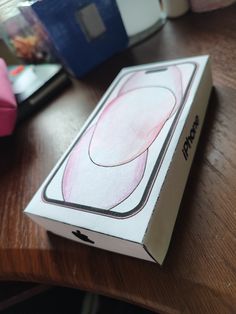 an apple box sitting on top of a wooden table