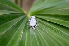 Handmade Moonstone Gemstone decked in Sterling Silver Ring. A dainty ring for everyday wear. *As these are Natural stones, the stones may vary in character, size and color. *Each item is handmade and thus could have slight imperfections or irregularities due to the human involvement in the process. Materials: ~ Natural Moonstone Gemstone ~ 925 Sterling Silver Handling Time: 3-5 working days. Shipping: ~ Economy shipping takes 2-4 weeks to reach international destinations. This kind of shipping t Celestial Moonstone Ring With Moon Charm, Bohemian Moon Phase Ring, Celestial Sterling Silver Moonstone Ring With Moon Phase, Celestial Sterling Silver Moonstone Ring, Celestial Sterling Silver Moon Phase Moonstone Ring, Celestial Moon-shaped Moonstone Ring In Sterling Silver, Bohemian Sterling Silver Moon-shaped Crystal Ring, Bohemian Moonstone Crystal Ring In Moon Shape, Sterling Silver Bohemian Moon Crystal Ring