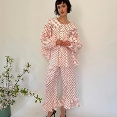 Crafted from vintage 50% viscose 50% cotton  Red dots Ruffles Rounded collar Vintage buttons Elastic cuffs  Elastic waist Relaxed fit   Designed and made in Europe    Sizes available or custom made following your measurements  Model is wearing size 8/10-S/M Vintage Pjs, Polka Dot Outfit, Cute Polka-dotted Cotton Set, Polka Dot Editorial, Fitted Vintage Polka Dot Blouse, Polka Dot Button-up Dress, Red Polka Dot Dress Vintage, Polka Dots Outfit, Cute Pajama Sets