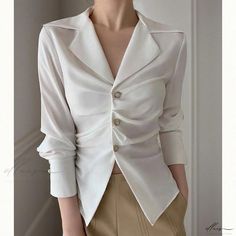 Elluis - Elegantly Refined: Sophisticated and Figure-Enhancing White Blouse Elegant Tailored V-neck Top, Elegant Semi-formal Tops With Lapel Collar, Chic Semi-formal Blouse With Lapel Collar, Formal Lapel Collar Top For Fall, Modern V-neck Blouse For Formal Occasions, Semi-formal Spring Blouse With Lapel Collar, Elegant Spring Blouse For Formal Occasions, Elegant Formal Blouse For Spring, Elegant Blouse For Spring Formal Events