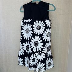 Victoria Beckham For Target Size: Xs Black & White Daisy Floral Printed Sleeveless Dress Scalloped Crew Neck W/ Tie And Buttons In Back Of Neck Lined Ruffle Hem Measurements Are Shown In The Photos Machine Wash New Condition. Never Worn. New With Tags Sleeveless Mini Dress With Daisy Print, Sleeveless Daisy Print Mini Dress, Casual Fitted Sunflower Print Dress, Casual Fitted Dress With Sunflower Print, Sleeveless Cotton Dress With Daisy Print, Fitted Black Dress With Daisy Print, Fitted Summer Dress With Sunflower Print, Sleeveless Daisy Print Sundress, Victoria Beckham For Target