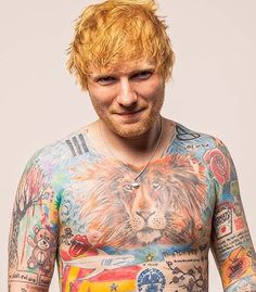 a man with red hair and tattoos on his body