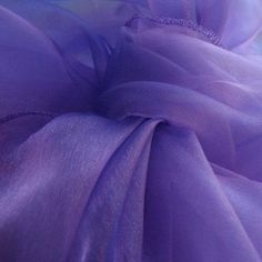 closeup of purple fabric with white background