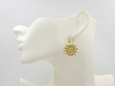 "These are lovely and beautiful shinning golden plated sunflower earrings. They hang underneath golden plated French ear wires. The earrings measure about 37mm (1.5 inches) long from the top of the earwires to the bottom of the flower. A wonderful idea for gift giving or as a little treat for yourself. Your item will arrive in gift wrap and ready to gift. Measurements and details: Total length: approximately37mm (1.5\") Flower: 24mm across Ear wire: golden plated French ear wires PLEASE NOTE: Al Gold Flower Charm Earrings For Summer, Gold Flower Earrings For Pierced Ears, Summer Season, Gold Drop Flower Earrings For Summer, Gold Flower Shaped Jewelry For Summer, Gold Flower-shaped Jewelry For Summer, Anniversary Gold Jewelry With Sunflower Design, Gold Hypoallergenic Flower Earrings For Anniversary, Hypoallergenic Gold Flower Earrings For Anniversary, Gold Jewelry With Sunflower Design For Summer