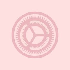 a pink background with an image of gears in the center and a white circle on top