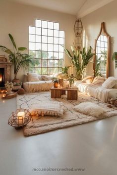 a living room filled with lots of furniture and plants on top of a white floor