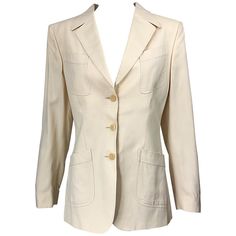 Chic and classic vintage THIERRY MUGLER COUTURE ivory / off-white silk blazer jacket! Mugler is the king of creating the perfect blazer for women, with flattering seams and silhouettes. Classic tailored fit, with just the right amount of a futuristic nod. Two tilted pockets at each breast, with two tilted pockets at each side of the waist. Three buttons up the front. Fully lined. Can easily be dressed up or down. Great with jeans, shorts, trousers, a skirt, or even over a dress. In great conditi Classic Cream Single-breasted Blazer, Vintage White Formal Blazer, White Vintage Formal Blazer, Classic Tailored Cream Blazer, Cream Single-breasted Blazer For Tailoring, Classic Silk Blazer For Spring, Vintage Cream Blazer For Work, Vintage Cream Blazer For Workwear, Vintage Cream Blazer For Formal Occasions