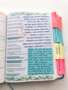 an open bible with colorful sticky notes attached to the pages and writing on each page