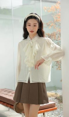 Chiffon blouse with a button down front lined with pearl buttons, ruffled Victorian front, frilly cuffs and lace trims all over. S: 14" across shoulders, 36" chest, 23" lengthM: 14.5" across shoulders, 37.5" chest, 23" lengthL: 15" across shoulders, 39" chest, 23" length Lace Button-up Blouse With Lace Cuffs, Elegant Collared Blouse With Lace Trim, Long Sleeve Office Blouse With Lace Trim, Long Sleeve Blouse With Lace Trim For Office, Chic Button-up Blouse With Lace Collar, Spring Blouse With Ruffled Collar And Buttons, Button-up Blouse With Lace Cuffs For Work, Lace Blouse With Button Closure For Work, Workwear Button-up Blouse With Lace Cuffs