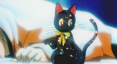 a black cat is standing in the snow wearing a yellow bow tie and looking at something