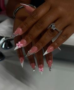 a woman's hand with pink and white nails