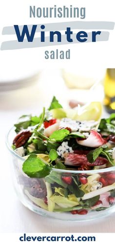 a salad in a glass bowl on top of a table