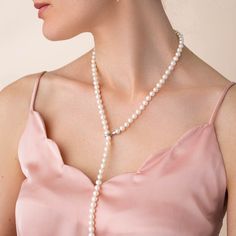 The Adjustable Pearl Lariat Necklace is approximately 27 inches in length with beautifully graduated freshwater pearl gemstones. The pearls are 7mm with the end steadily increasing to larger 10mm pearls. The sterling silver clasp allows you to adjust the graduated strand to a length unique to you. The strand can also be worn down the back to accent that backless dress or as a perfect bridal ensemble. Luxury Dainty Single Strand Pearl Necklace, Elegant Lariat Necklace With Pearl Drop, Elegant Long Drop Lariat Necklace With Pearl, Elegant Pearl Necklace With Pendant, Elegant Long Pearl Pendant Necklace, Timeless Lariat Necklace For Weddings, Elegant Pearl Charm Lariat Necklace, Luxury Pearl Lariat Necklace, Elegant Long Drop Single Strand Lariat Necklace