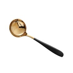 a gold spoon with a black handle on a white background