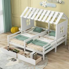 a child's bed with two beds underneath it and storage drawers below the bed