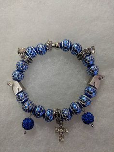 8" Blue and silver beaded bracelet with multi charms (With magnetic clasp) Adjustable Silver Charm Bracelet With Large Beads, Blue Metal Charm Bracelet With Lobster Clasp, Blue Metal Beads Jewelry As Gift, Blue Metal Beads Jewelry For Gifts, Blue Crystal Bracelet With Silver Beads, Blue Crystal Bracelet With Round Beads And Lobster Clasp, Blue Crystal Bracelet With Lobster Clasp And Round Beads, Blue Nickel-free Crystal Bracelet For Gift, Blue Nickel-free Crystal Bracelet Gift