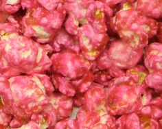 pink and yellow popcorn with sprinkles on it