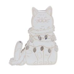 an image of a white cat with beads on it's collar and tail sitting down