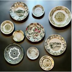 a table topped with lots of plates covered in different designs