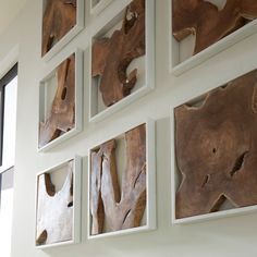 several pieces of wood are mounted on the wall