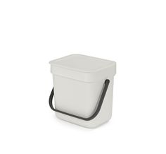 a white container with a black handle on it