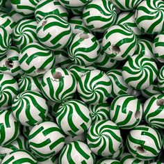 many green and white balls are stacked together