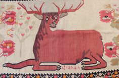 an old rug with a deer on it