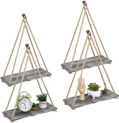 two wooden shelves with rope hanging from the sides, one holding a clock and another holding a potted plant