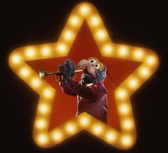 a person with a trumpet in front of a star