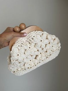 Crochet Raffia Bag, Beige Luxury Handbags, Mothers Day Gifts, Vintage Clutch Bag, Handmade with Motifs Clutch Bag for Women,Gift for Her  ❤️You will love this handmade crochet bag ❤️ ⭐️ A complete complement that you can use anytime, anywhere, day or night. ⭐️ Easy to use with wooden handle ⭐️ Lined inside, does not stretch The inside of the bag is wide, You can easily carry your personal belongings. Specification and materials of this piece: Rafia Yarn, Board Scholarship, lined inside Width: 32 Handmade Cream Handheld Bag, Handmade Cream Handheld Bags, Handheld Handmade Cream Bag, Handheld Cream Handmade Bag, Cream Crochet Pouch Bag For Daily Use, Cream Bag With Detachable Handle As Gift, Daily Use Cream Crochet Pouch Bag, Eco-friendly Cream Pouch Bag, Handmade White Clutch Pouch